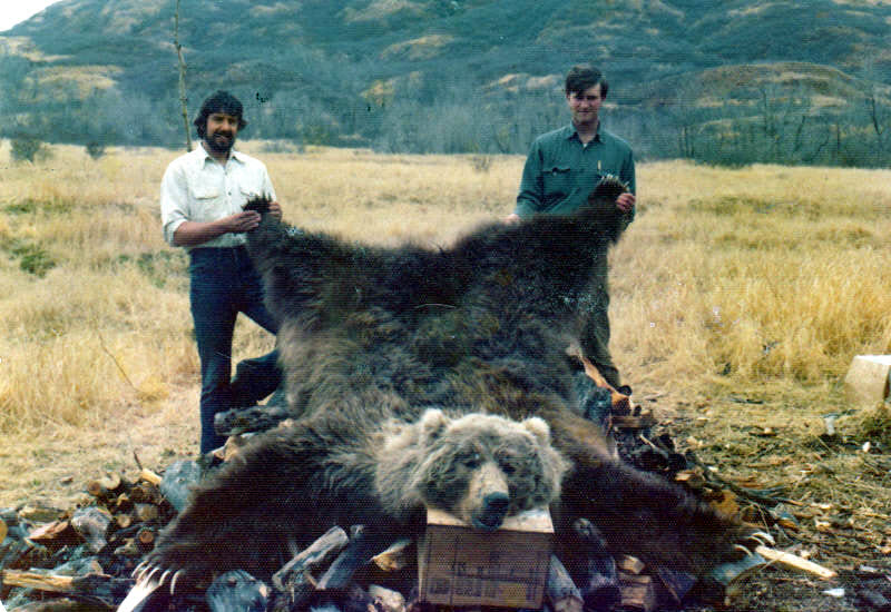 Greg Feere and friend in Alaska with a huge dead bear