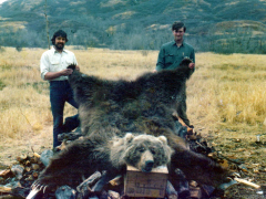 Greg Feere and friend in Alaska with a huge dead bear