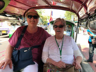 Linda and Joyce in a cab